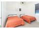 Bedroom with two twin beds and coral bedding at 1922 6Th St E, Palmetto, FL 34221