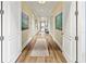 Bright hallway with hardwood floors and artwork at 1922 6Th St E, Palmetto, FL 34221