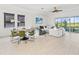 Open concept living area with a large sectional sofa and dining table at 1922 6Th St E, Palmetto, FL 34221