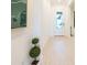 Bright and airy entryway with light wood-look tile flooring at 1922 6Th St E, Palmetto, FL 34221