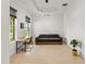 Living room featuring a sectional sofa and a workspace at 1922 6Th St E, Palmetto, FL 34221