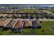 Aerial view of a home with pool and backyard in a waterfront community at 1922 6Th St E, Palmetto, FL 34221