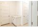 Bright hallway with white doors and built-in cabinets at 1922 6Th St E, Palmetto, FL 34221