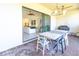 Outdoor patio with dining table and access to living area at 1922 6Th St E, Palmetto, FL 34221