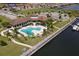 Aerial view of community pool, clubhouse, and neighborhood at 1922 6Th St E, Palmetto, FL 34221