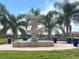 Elegant tiered fountain surrounded by palm trees at 1922 6Th St E, Palmetto, FL 34221