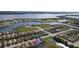 Aerial view showcasing a waterfront community with a single-Gathering home highlighted at 1922 6Th St E, Palmetto, FL 34221