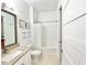 Bathroom with tub shower combo, vanity, and toilet at 1922 6Th St E, Palmetto, FL 34221