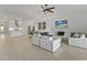 Open concept living room and kitchen area with light tile floors at 1922 6Th St E, Palmetto, FL 34221