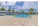 Resort-style pool with palm trees and patio area at 1922 6Th St E, Palmetto, FL 34221