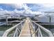 Wooden walkway leads to boat slips at the marina at 1922 6Th St E, Palmetto, FL 34221