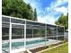 Relaxing pool area with screened enclosure at 4724 Seville Dr, Sarasota, FL 34235
