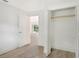 Bedroom with vinyl flooring, closet, and view of backyard at 4724 Seville Dr, Sarasota, FL 34235