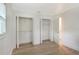 Bedroom with double closets and light wood flooring at 4724 Seville Dr, Sarasota, FL 34235