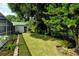 Landscaped backyard with lush greenery at 4724 Seville Dr, Sarasota, FL 34235