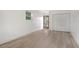 Bright bedroom with vinyl flooring and exterior access at 4724 Seville Dr, Sarasota, FL 34235
