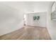 Spacious living room with vinyl flooring and kitchen access at 4724 Seville Dr, Sarasota, FL 34235