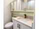 Modern bathroom with white cabinets, quartz countertop, and stylish faucet at 4724 Seville Dr, Sarasota, FL 34235