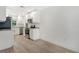 Modern kitchen with white cabinets, stainless steel appliances, and light flooring at 4724 Seville Dr, Sarasota, FL 34235