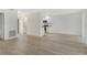 Open concept kitchen with white cabinets and new flooring at 4724 Seville Dr, Sarasota, FL 34235