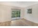 Bright bedroom with sliding glass doors leading to a screened patio at 4724 Seville Dr, Sarasota, FL 34235