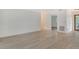 Bright living area with updated flooring and shiplap feature wall at 4724 Seville Dr, Sarasota, FL 34235