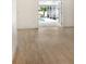 Light and airy living area with vinyl flooring and access to the pool at 4724 Seville Dr, Sarasota, FL 34235
