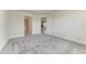 Spacious bedroom with grey carpet and an open door to the hallway at 4254 Golden Creek Ter, Parrish, FL 34219
