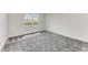 Bright bedroom with grey carpet and large window offering natural light at 4254 Golden Creek Ter, Parrish, FL 34219