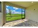 Spacious screened patio with a view of the backyard at 4254 Golden Creek Ter, Parrish, FL 34219