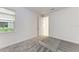 Bright bedroom featuring grey carpet and an open door at 4254 Golden Creek Ter, Parrish, FL 34219