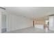 Open living area with tile floors and views of kitchen and hallway at 4254 Golden Creek Ter, Parrish, FL 34219
