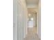 Bright hallway with white doors and tile flooring at 4254 Golden Creek Ter, Parrish, FL 34219