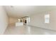 Open concept living room with tile floors and access to kitchen at 4254 Golden Creek Ter, Parrish, FL 34219