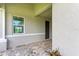 Covered entryway with paver flooring and landscaping at 4254 Golden Creek Ter, Parrish, FL 34219