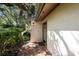 Light-colored villa with a brick walkway and lush landscaping at 3601 Quail Hollow Ln, Bradenton, FL 34210