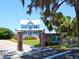 Blue house with white trim and porch located in a park at 12313 Baypointe Ter, Cortez, FL 34215