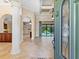 Elegant entryway with high ceilings, tile floors, and a view into the living area at 12313 Baypointe Ter, Cortez, FL 34215