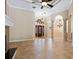 Open living room with high ceilings, tile floors, and a view of the entryway at 12313 Baypointe Ter, Cortez, FL 34215