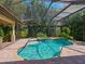 Inviting screened pool and spa with brick pavers at 12313 Baypointe Ter, Cortez, FL 34215
