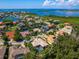 Aerial view of single Gathering home with pool in residential neighborhood at 12313 Baypointe Ter, Cortez, FL 34215