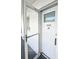 White front door with glass panel and storm door at 5933 17Th W St # A24, Bradenton, FL 34207