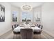 Modern dining room with large chandelier and window at 3811 Bayside Cir, Bradenton, FL 34210