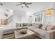 Open concept living room with large sectional sofa and wooden coffee table at 3811 Bayside Cir, Bradenton, FL 34210