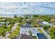 Aerial view of a waterfront home with pool and basketball court at 3811 Bayside Cir, Bradenton, FL 34210