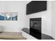 Modern fireplace with black granite and white tile surround, located in a living area at 3811 Bayside Cir, Bradenton, FL 34210