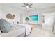 Bright main bedroom with large windows, a king-size bed and a TV at 3811 Bayside Cir, Bradenton, FL 34210