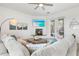 Relaxing living room with sectional sofa, fireplace and large TV at 3811 Bayside Cir, Bradenton, FL 34210