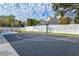 Private backyard basketball court with pink lines at 3811 Bayside Cir, Bradenton, FL 34210