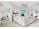 Open living room with sectional sofa and access to balcony at 3811 Bayside Cir, Bradenton, FL 34210